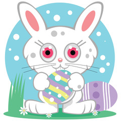 Bright eyed Easter Bunny holding a decorated egg