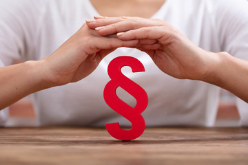 Woman's Hand Protecting Red Paragraph
