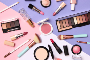 professional makeup tools. Makeup products on a colored background top view. A set of various...