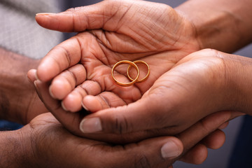 Man And Woman's Hand With Pair Of Rings