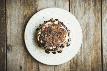 Fresh chocolate cake on the dark rustic background. Selective focus.