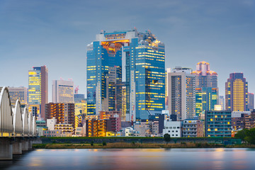 Fototapeta na wymiar Osaka, Japan skyline on the Yodogawa River at twilight.