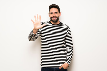 Fototapeta premium handsome man with striped shirt counting five with fingers