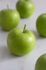 green apples closeup on paper background.