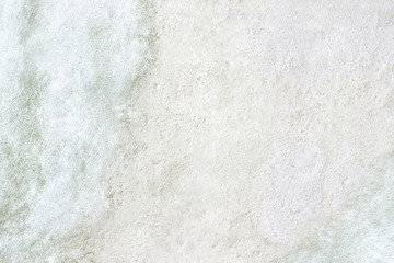 Snow texture frame on white concrete background. Outdoor old floor covered with snow.