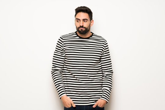 handsome man with striped shirt feeling upset