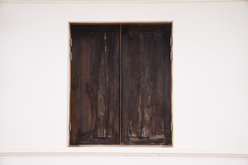 Black wood  Thai windows on white wall.