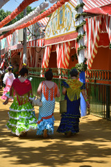 beautiful colors of flamenco dresses at the Feria de Abril in Seville © corradobarattaphotos