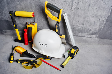 Obraz premium set of construction tools on a black wall background