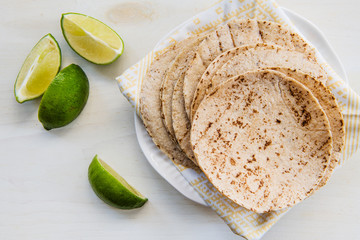 Fresh tortillas with lime slices