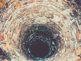 Black hole inside the rock water well