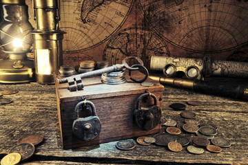 Treasure chest.Padlocks and keys.Ship  lantern,pirate map.Binoculars,monocles,spy glass.Travel and marine engraving background.Vintage style.Treasure hood concept.Old coins.Gold,silver.