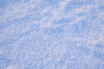 Texture of white snow with blue tint winter background.