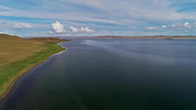 Calm Waters Of Mongolian Lake Telmen Lake Surrounded By Hills. Mongolia.
