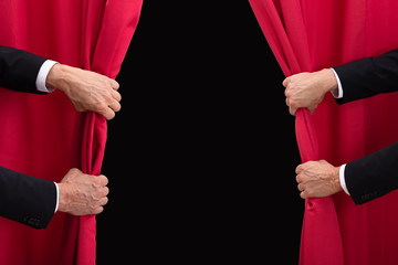 Two Men Opening Red Curtain © Andrey Popov