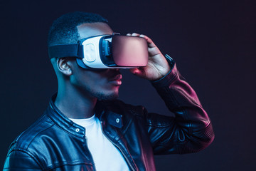 VR technology. Young african man wearing virtual reality headset