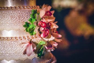 cakes decorated for social events, modern wedding cake with decorative flowers.