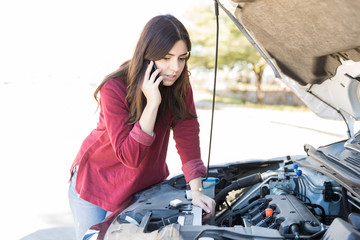 Woman Calling For Assistance Near Breakdown Car