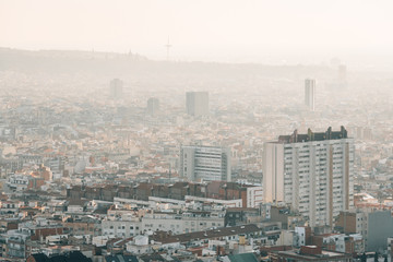Hazy cityscape view from Bunkers del Carmel, in Barcelona, Spain