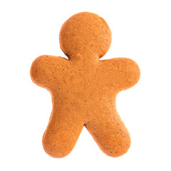 Baked gingerbread from shortbread in the form of a little man. Isolated on white background. Attribute of holiday, christmas etc.