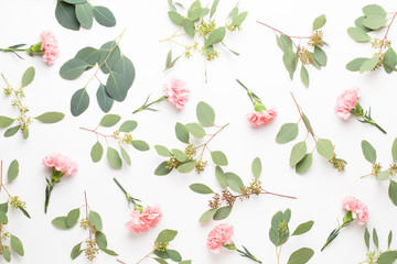 Flowers and eucalyptus composition. Pattern made of various colorful flowers on white background. Flat lay stiil life.