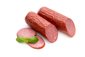 Salami smoked sausage, basil leaves on white background cutout.