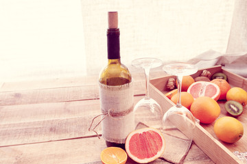snack with a bottle of wine and fruit