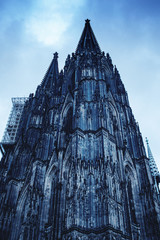 Look up shot of the historic gothic cathedral K&ouml;lner Dom at moody dark blue winter day. K&ouml;ln, Cologne in Germany
