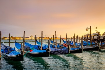 Gondolas moored, Venice, Italy. Gondolas boats parking in grand