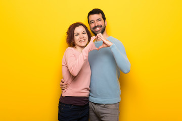 Couple in valentine day making a heart with hands