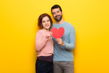 Fototapeta na wymiar Couple in valentine day holding a heart symbol