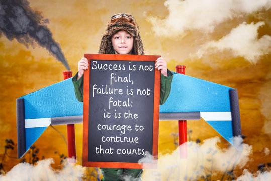 Boy holding chalkboard