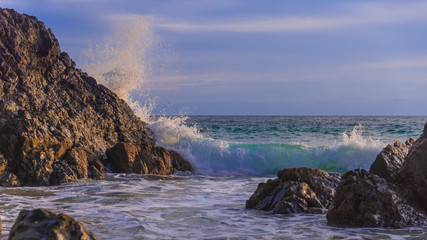 waves crashing on rocks