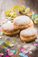 Krapfen, Berliner or  donuts with streamers and confetti