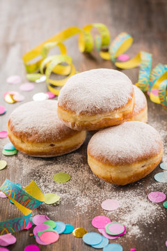 Krapfen, Berliner or  donuts with streamers and confetti