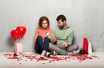 Couple in valentine day taking a credit card without money