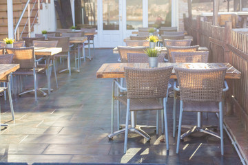 Cafe, coffee shop, tavern and restaurant concept - Outdoor street cafe tables ready for service.