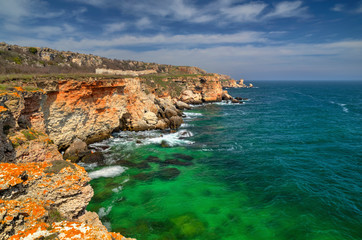 Fototapeta na wymiar Beautiful landscape with blue sea and rocky shore