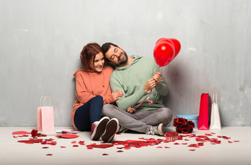 Couple in valentine day with balloons with heart shape