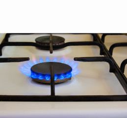 Burning gas, gas stove burner, hob in kitchen.