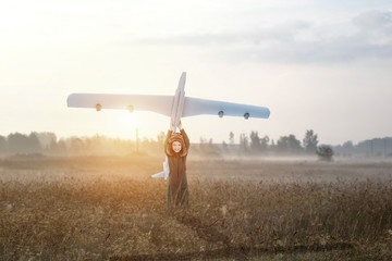 Boy playing with airplane