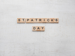 St.Patrick 's Day. Beautiful card. White isolated background, close-up, top view, wooden surface. Congratulations for loved ones, relatives, friends and colleagues