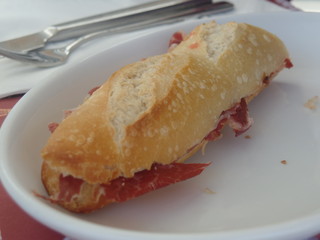 Baguette sandwich filled with Parma ham