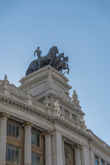 Fototapeta na wymiar View of the Quadriga on the left on the top of Building, Madrid, Spain