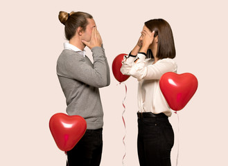 Couple in valentine day covering eyes by hands. Surprised to see what is ahead over isolated...