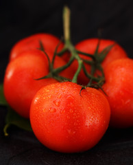 bunch of tomatoes with drops