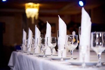 Empty wine glass on the banquet table.Table setting for a banquet or dinner party.