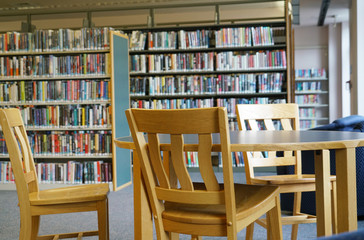 round table in the library in front of book shelves