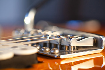 Fototapeta na wymiar close up shiny bridge on electric guitar