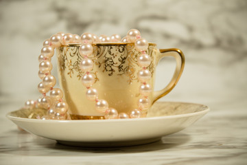 Obraz na płótnie Canvas Tea Cups and Pearls